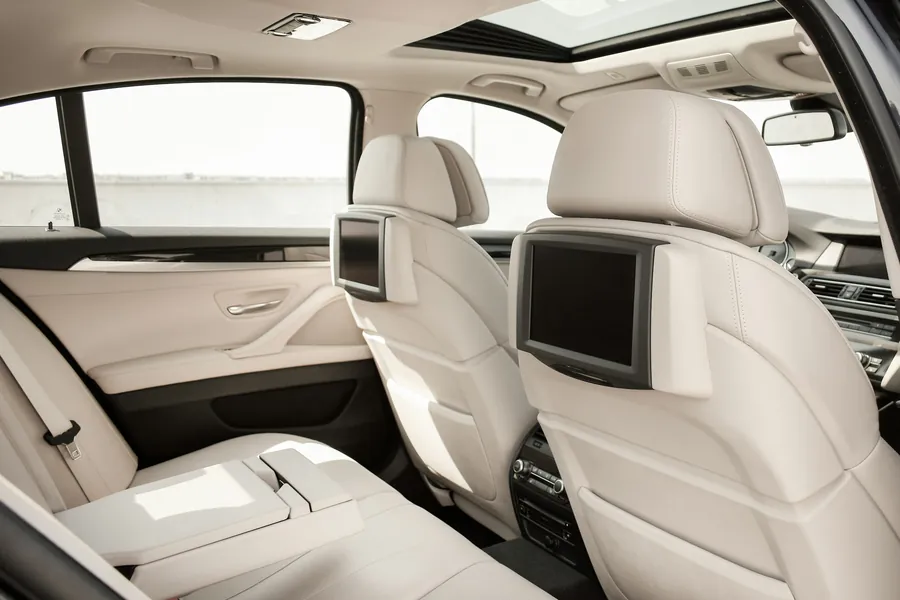 Cream leather rear seats of an executive car